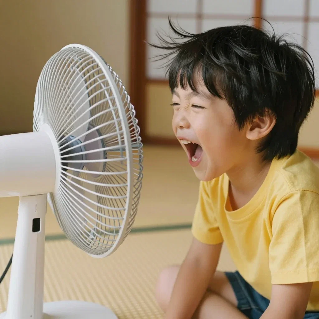 boy enjoying fan breeze in tatami room